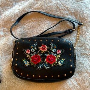 Black Aldo floral bag with gold studs.